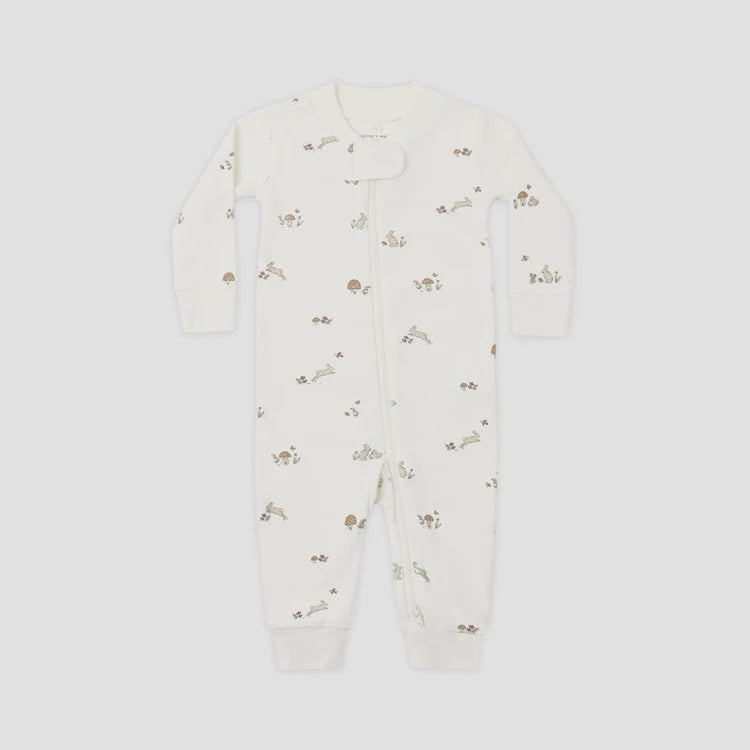 An off-white long-sleeve baby footless one-piece sleeper with a small brown bunny print, shown flat on a light gray background.