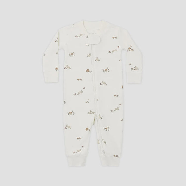 An off-white long-sleeve baby footless one-piece sleeper with a small brown bunny print, shown flat on a light gray background.