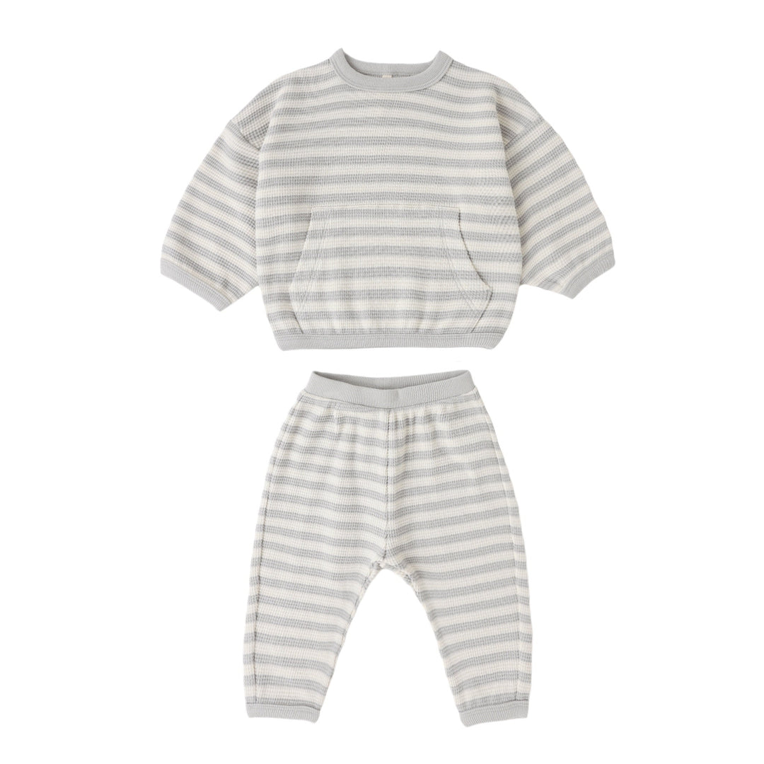 Striped children's outfit with top and pants on a white background