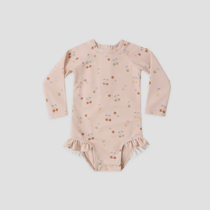 Pink floral-patterned baby onesie on a light gray background