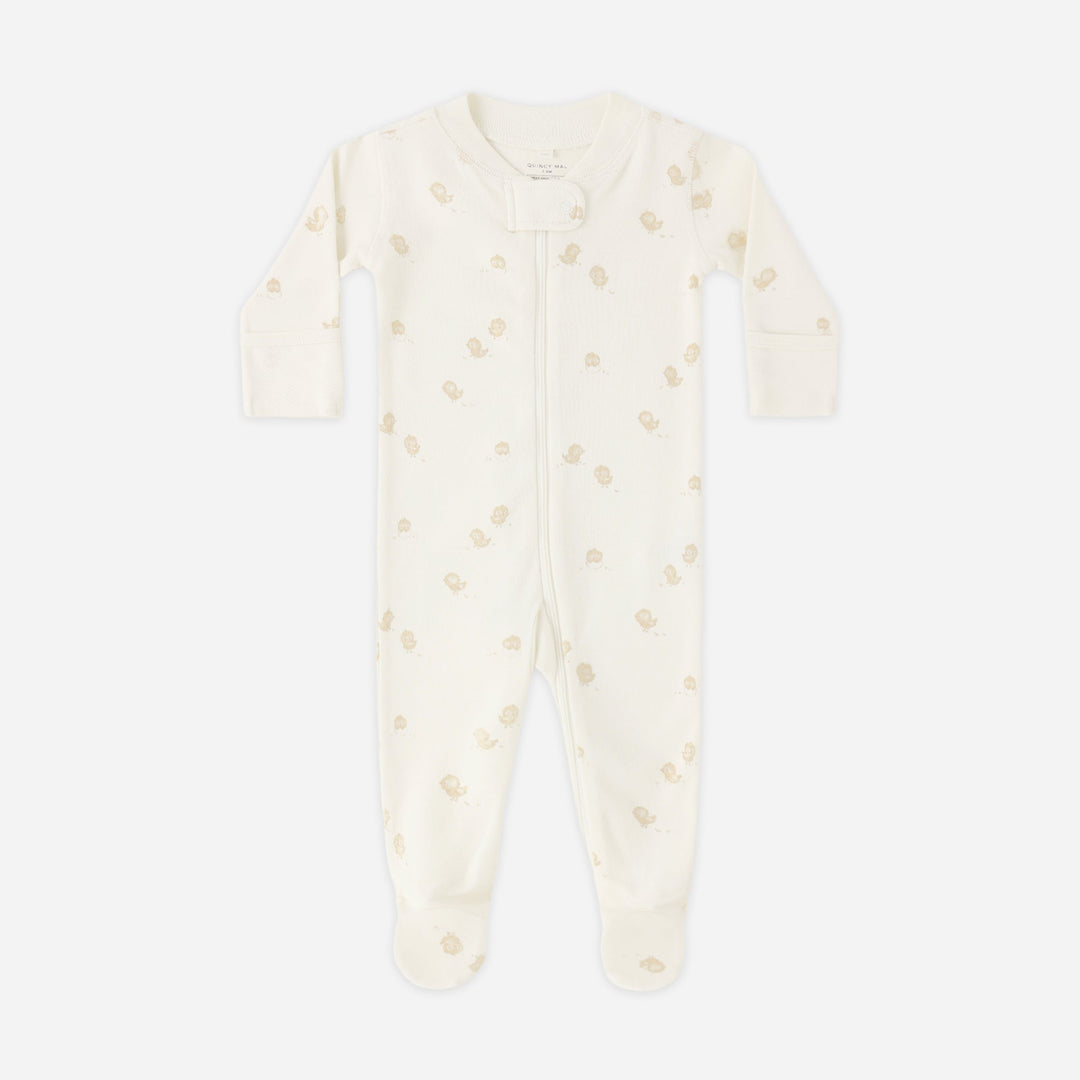 Baby onesie with small patterns on a white background