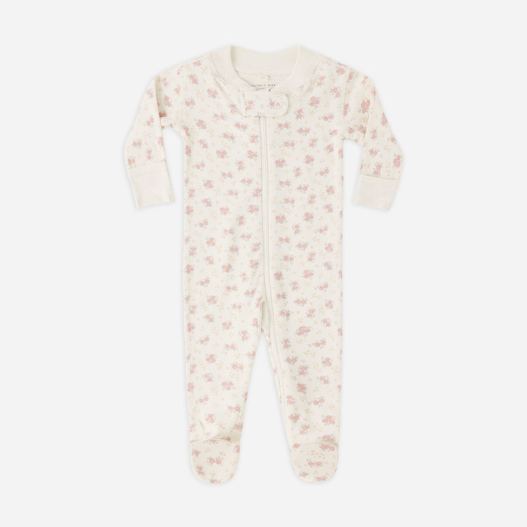 Baby onesie with floral pattern on a white background