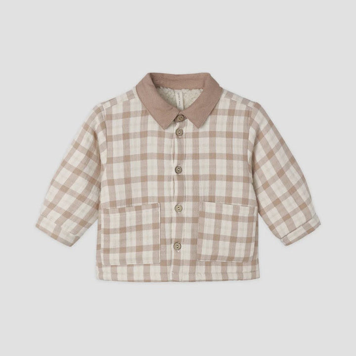 A toddler's long-sleeve button-up shirt jacket featuring a beige and cream gingham plaid pattern, a solid beige collar, and front buttons, shown on a plain light gray background.