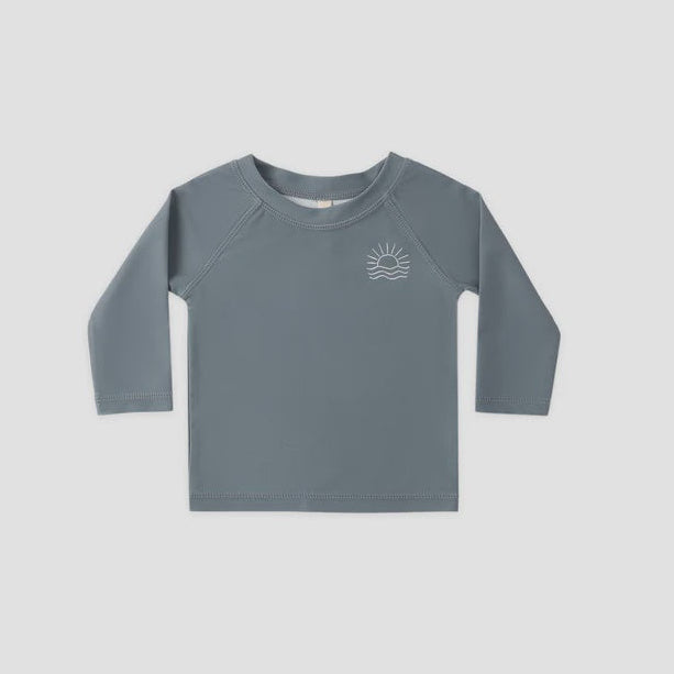 Gray long-sleeve shirt with a small logo on a light gray background