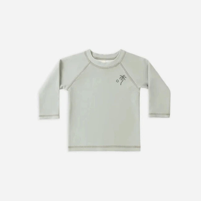 Light gray long-sleeve shirt with a small design on a white background