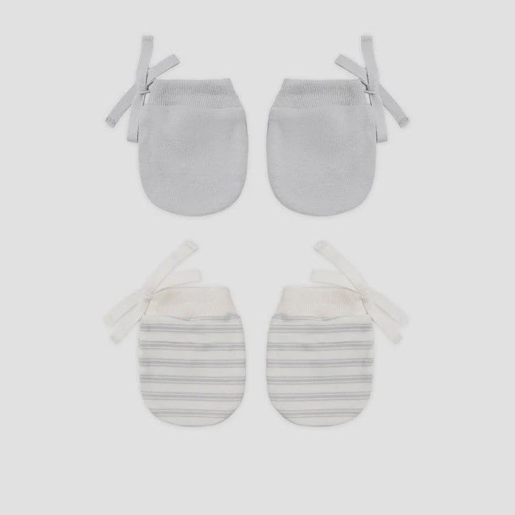 Two pairs of baby mittens laid flat on a light gray background. The top pair is solid light gray, and the bottom pair has thin gray horizontal stripes on an off-white base with white ties.