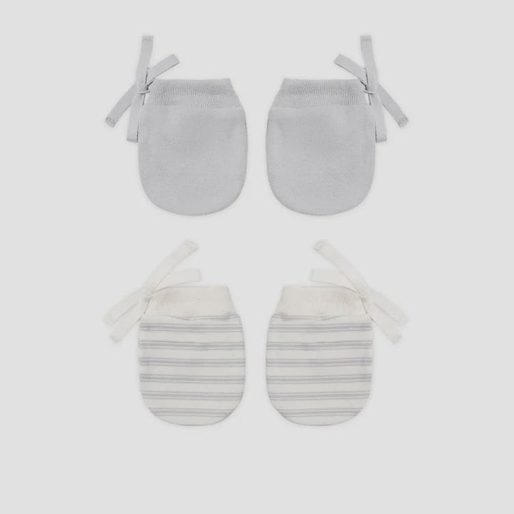 Two pairs of baby mittens laid flat on a light gray background. The top pair is solid light gray, and the bottom pair has thin gray horizontal stripes on an off-white base with white ties.