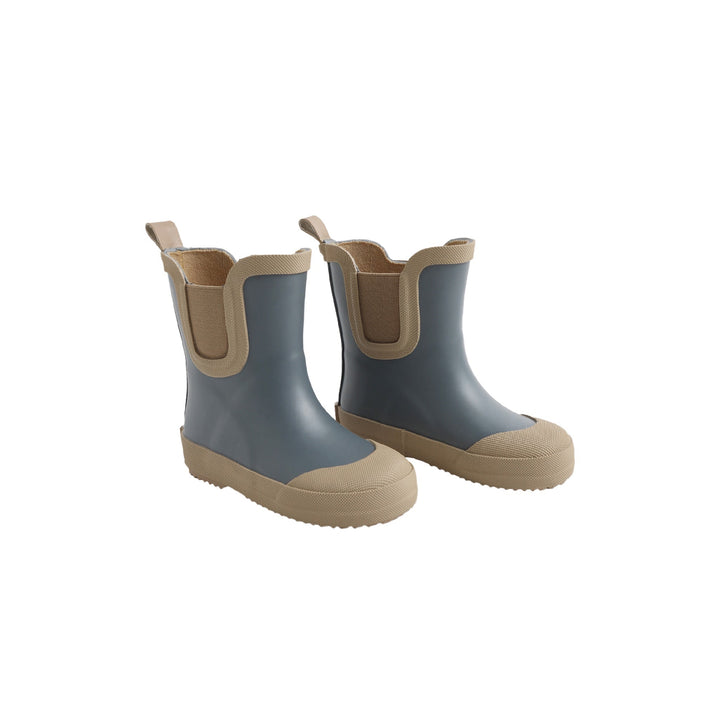 Pair of gray and beige rubber boots on a white background