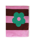Striped towel with a green flower design on a white background