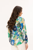 Woman wearing a floral blouse with a white background