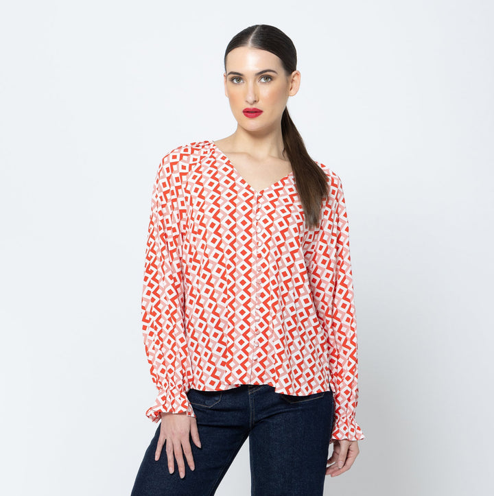 The Asher Top - Gemstone is a must-have addition to your wardrobe. With its long sleeves and flattering v neck, this top offers both comfort and style available from www.thecollectivenz.com