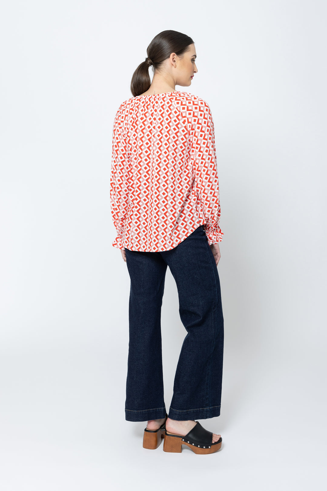 The Asher Top - Gemstone is a must-have addition to your wardrobe. With its long sleeves and flattering v neck, this top offers both comfort and style available from www.thecollectivenz.com