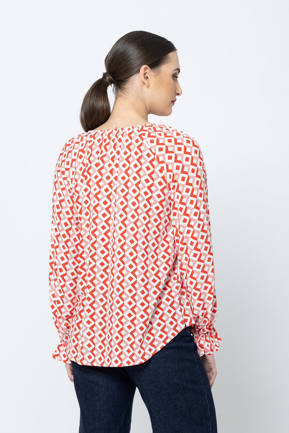 The Asher Top - Gemstone is a must-have addition to your wardrobe. With its long sleeves and flattering v neck, this top offers both comfort and style available from www.thecollectivenz.com