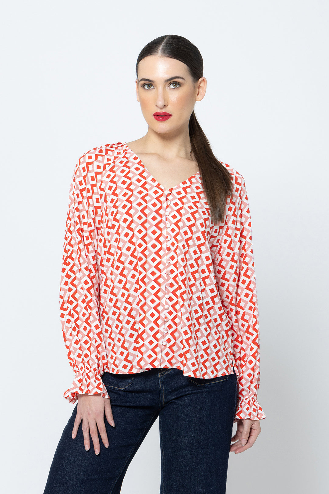 The Asher Top - Gemstone is a must-have addition to your wardrobe. With its long sleeves and flattering v neck, this top offers both comfort and style available from www.thecollectivenz.com