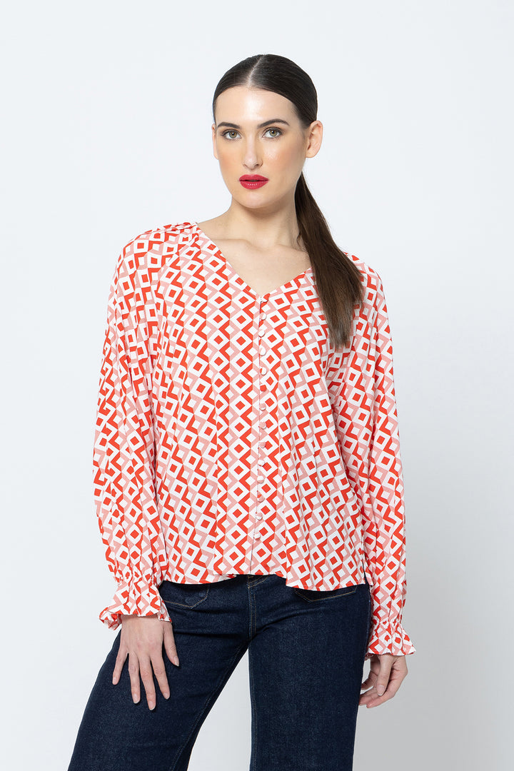 The Asher Top - Gemstone is a must-have addition to your wardrobe. With its long sleeves and flattering v neck, this top offers both comfort and style available from www.thecollectivenz.com