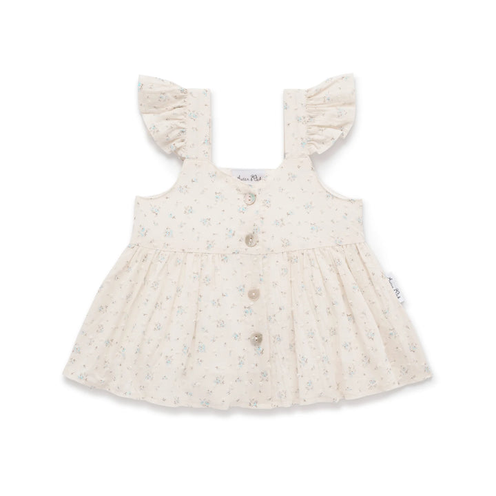 Baby dress with ruffled straps on a white background