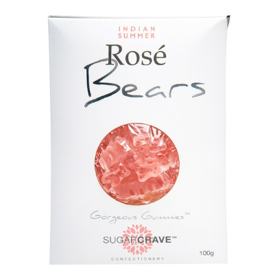 A white package of Sugar Crave Confectionery Rosé Bears Indian Summer gummi bears, featuring a circular clear window showing the pinkish-red gummi bears inside.