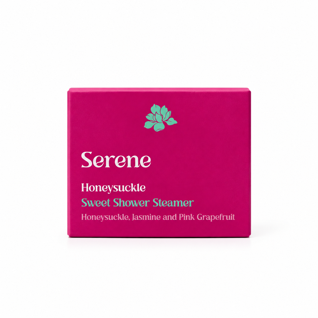 A bright magenta pink rectangular box for Serene Honeysuckle Sweet Shower Steamer, featuring a small mint green lotus flower logo and white and teal text on a clean white background.