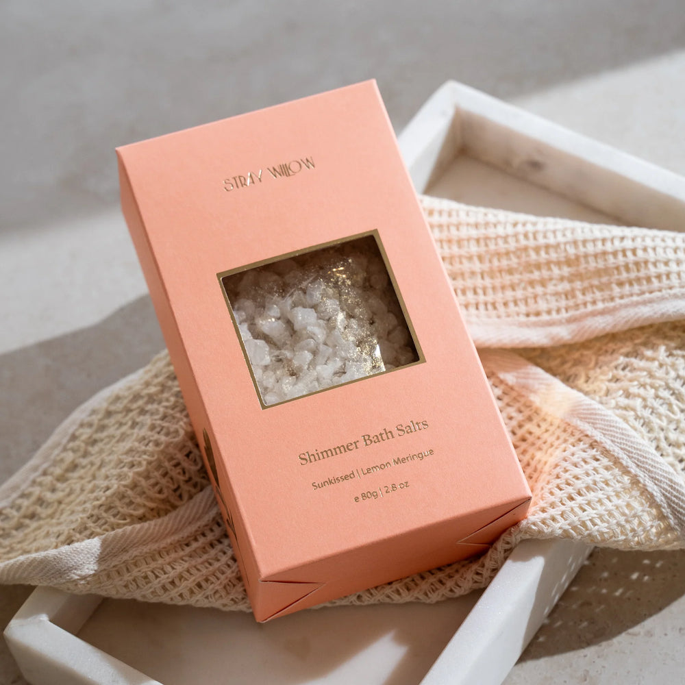 Pink box of Shimmer Bath Salts on a textured surface