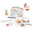 Set of children's musical instruments with a patterned case on a white background