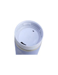 Purple tumbler with a white lid on a white background
