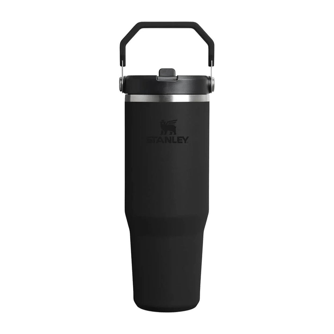 Black Stanley tumbler with handle on a white background