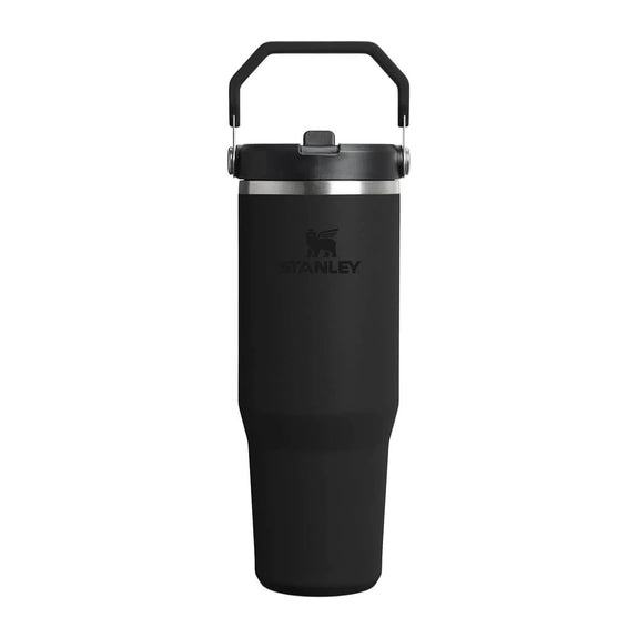 Black Stanley tumbler with a handle on a white background