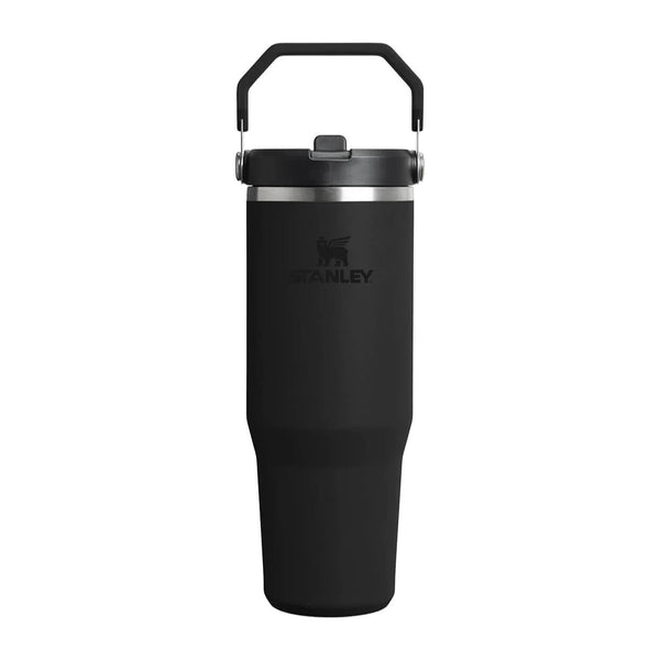 Black Stanley tumbler with a handle on a white background