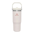 Blush Stanley tumbler with a handle on a white background