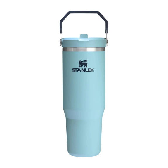 Light blue tumbler with black handle on a white background