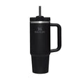Black Stanley mug with handle and straw on a white background