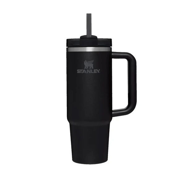 Black Stanley mug with handle and straw on a white background