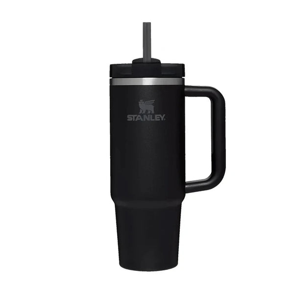Black Stanley mug with handle and straw on a white background