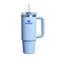 Light blue Stanley tumbler with handle on a white background