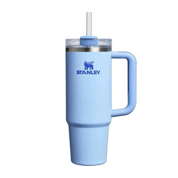 Light blue Stanley tumbler with handle on a white background