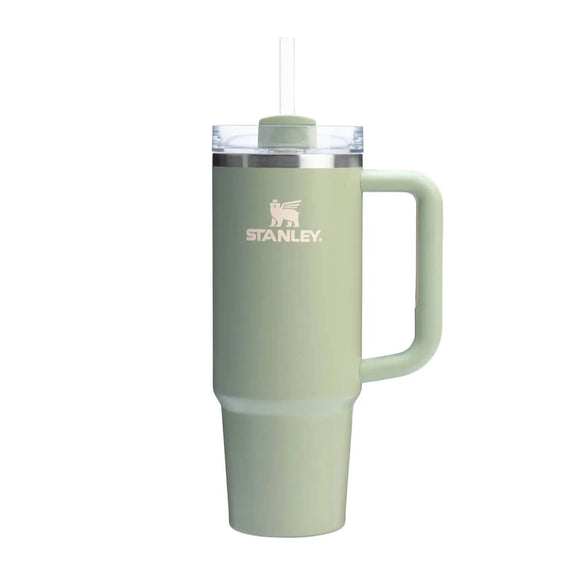 Green Stanley mug with handle on a white background