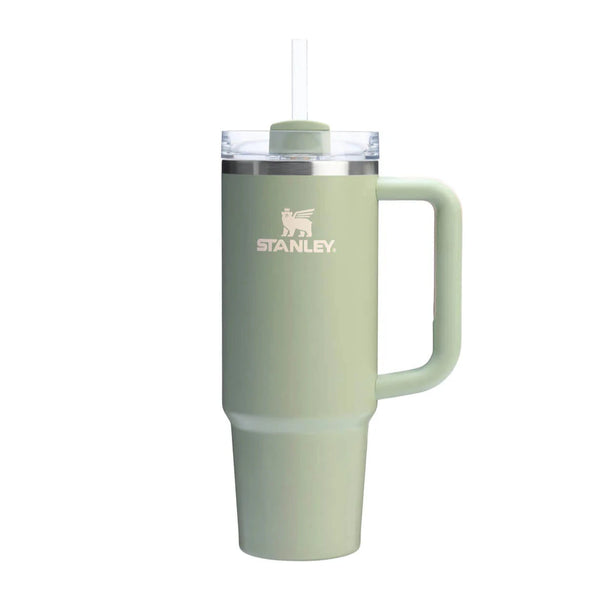 Green Stanley mug with handle on a white background