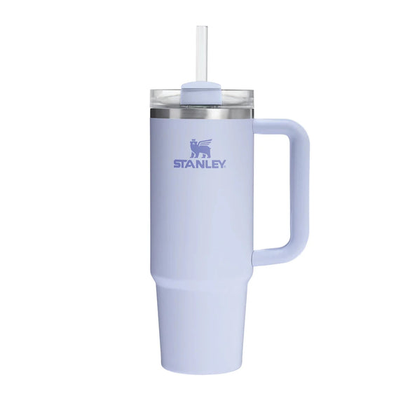 Light blue Stanley tumbler with handle and straw on a white background