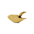 Gold bird-shaped object on a white background