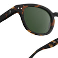 Sunglasses with tortoiseshell frame and green lenses on a white background
