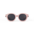 Pink sunglasses with black lenses on a white background