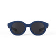 Blue sunglasses with dark lenses on a white background
