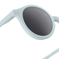 Light blue sunglasses with dark lenses on a white background