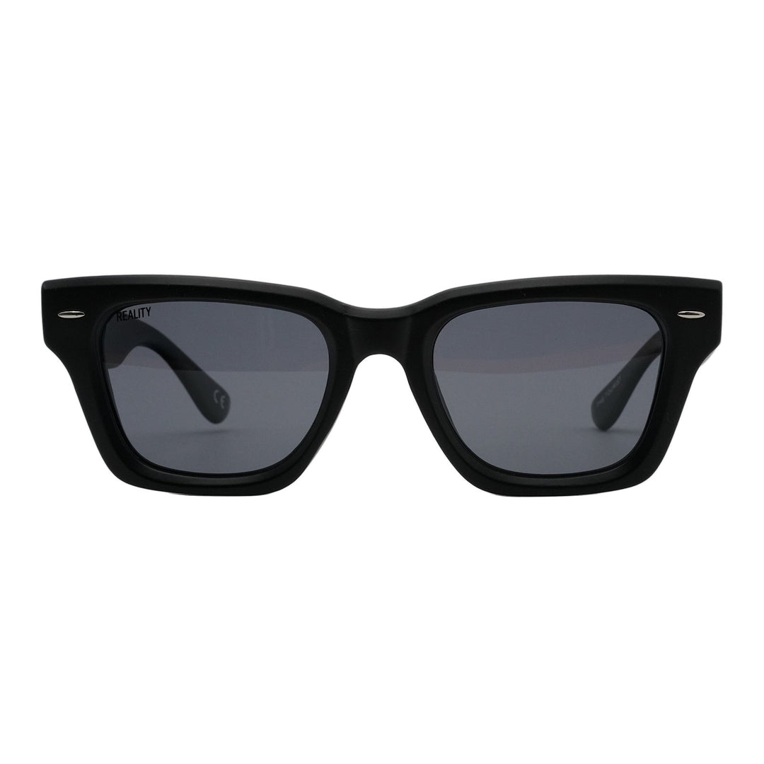 Black sunglasses with dark lenses on a white background