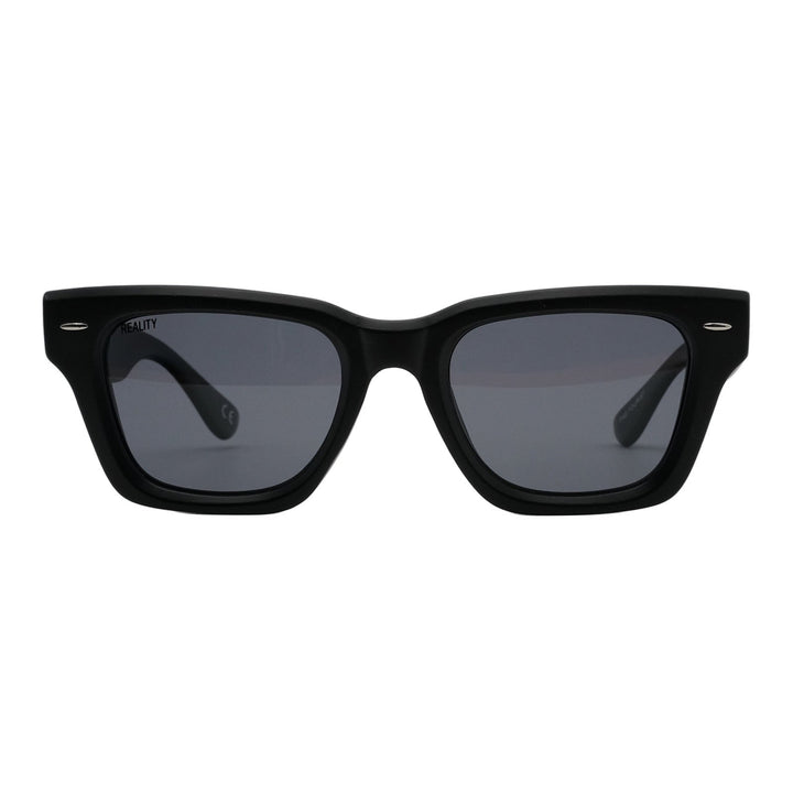 Black sunglasses with dark lenses on a white background