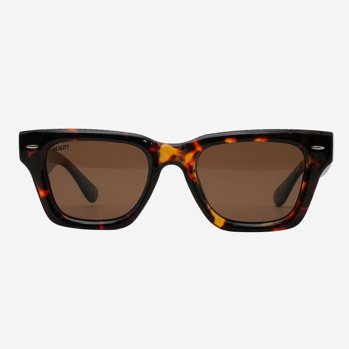 Square sunglasses with a dark brown and amber tortoiseshell acetate frame and brown tinted lenses, shown against a plain white background.