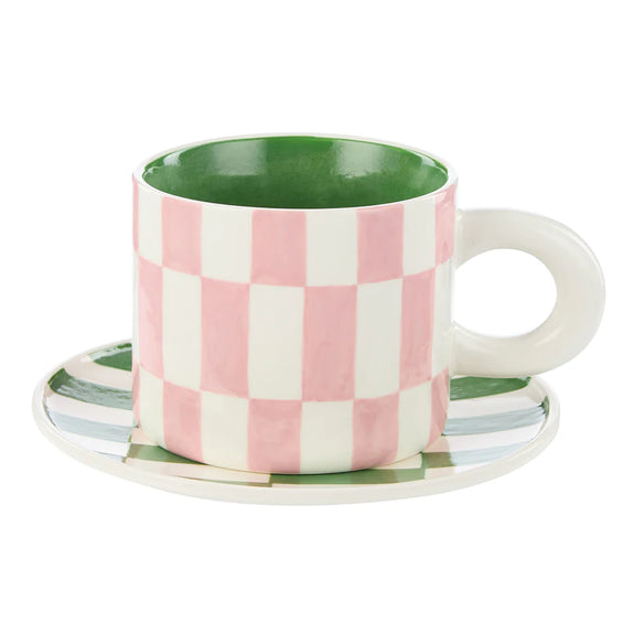 Checkered mug with a green interior on a white background