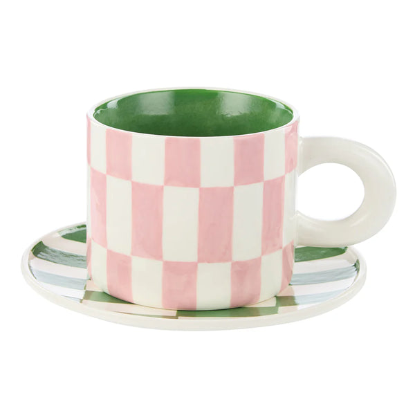 Checkered mug with a green interior on a white background