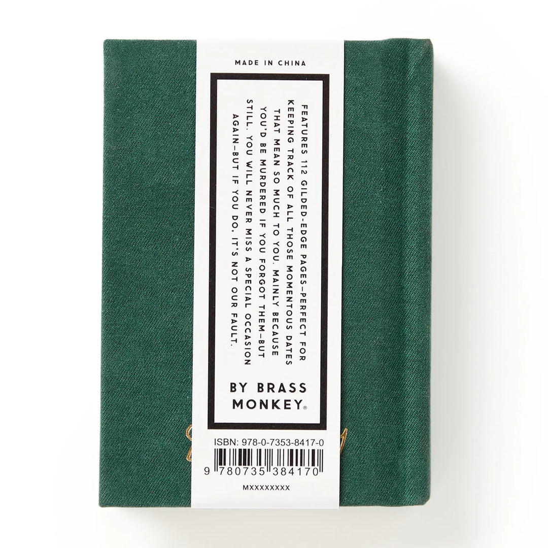 Green notebook with a label on a white background