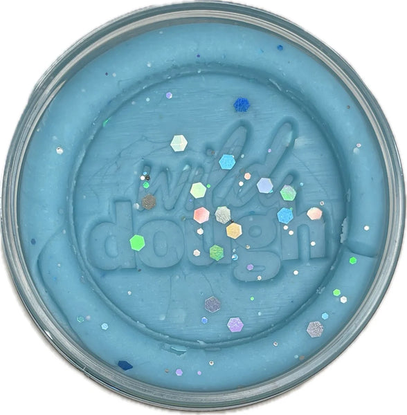 Blue slime with glittery confetti in a container labeled 'Wella Dazzle'.